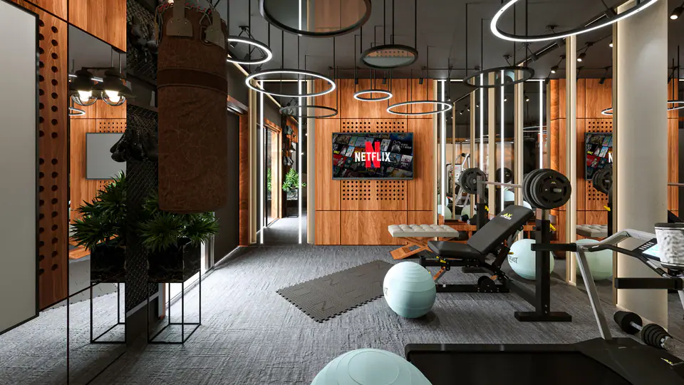 Luxury home gym with wood panelling, a bench, a punching bag and stability balls