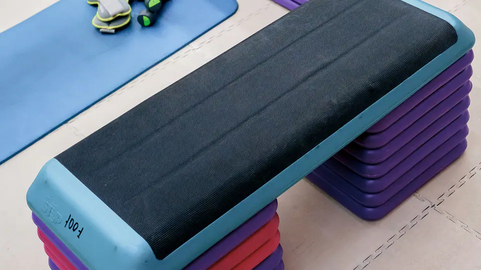 Aerobic step platforms and an exercise mat in a studio
