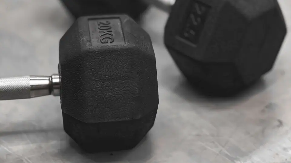 Pair of hexagonal dumbbells on a concrete floor